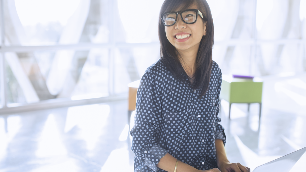 Woman On Laptop In Office