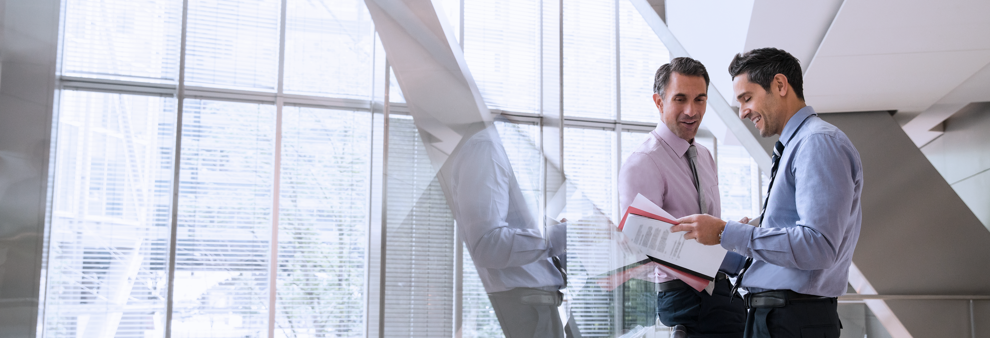 Two men reviewing documents